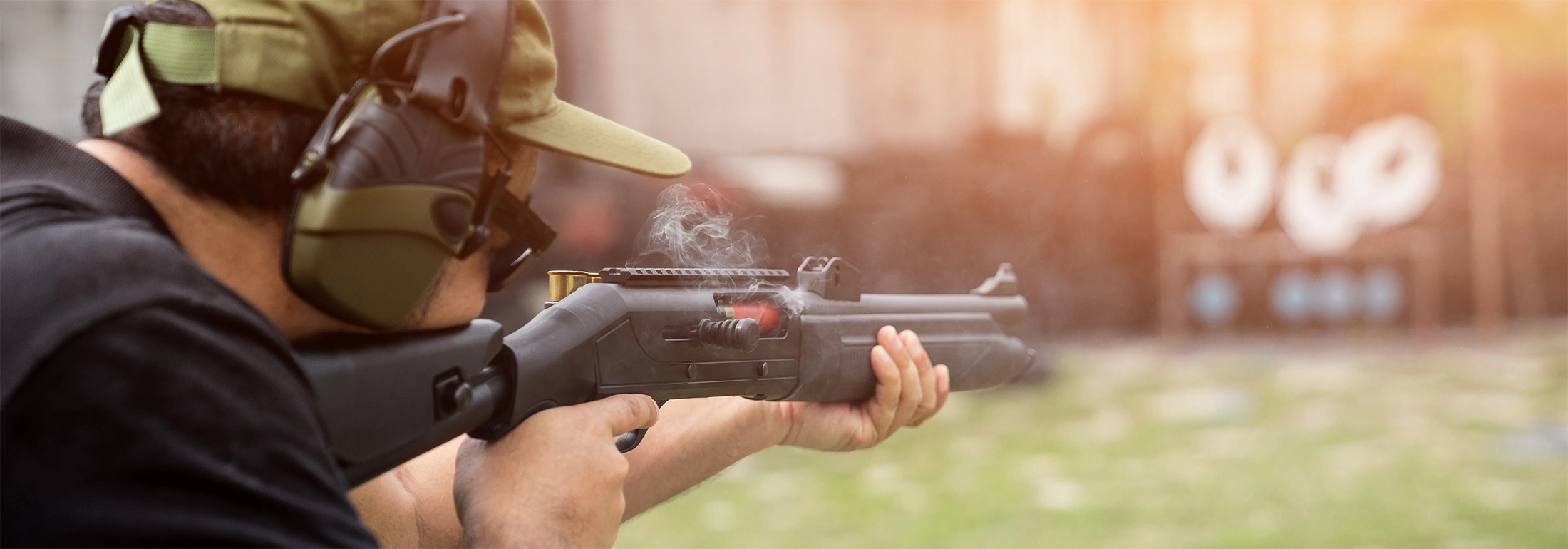 Man firing a shotgun